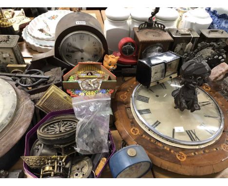 Clocks, clock parts and an aneroid barometer.