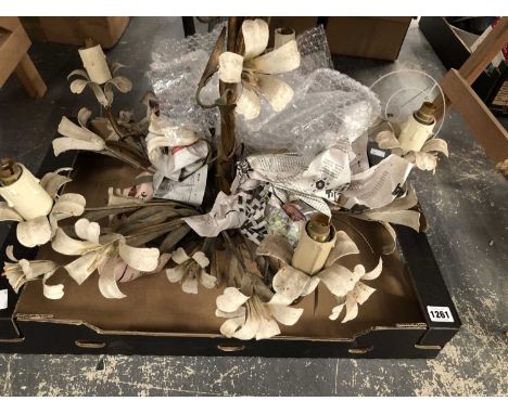 A five light white floral decorated chandelier