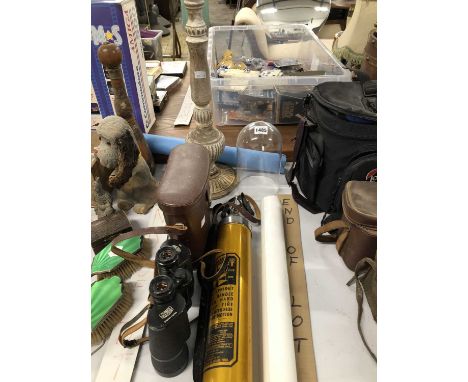 A leather-cased pair of binoculars, a wooden pricket candlestick, a Renault poster, a fire extinguisher, etc.