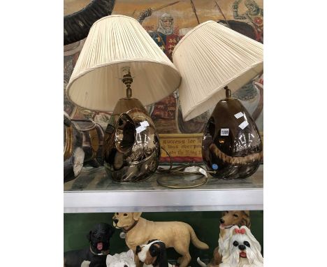 A pair of Poole Pottery copper lustre table lamps
