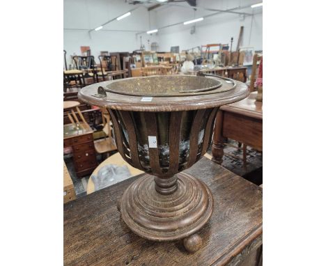 An oak and brass lined planter Dutch form.