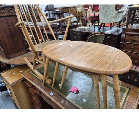 An Ercol nest of "pebble" tables and an Ercol rocking chair.