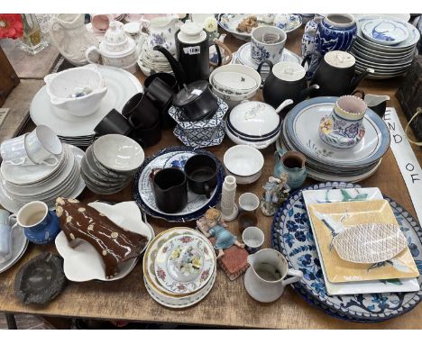 Raymond Loewy and other tea wares, various plates and dishes, a German porcelain figure of a boy eating grapes, Japanese enam