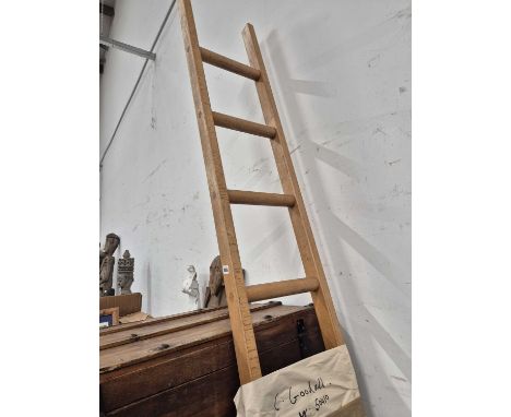 A modern wooden loft or library ladder.