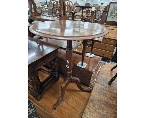 A Victorian tripod occasional table.