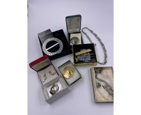 A Ladycrow Scotland pewter scarf ring, a silver Viking design brooch from the British Museum, a Shatter It brooch by Susan Ha