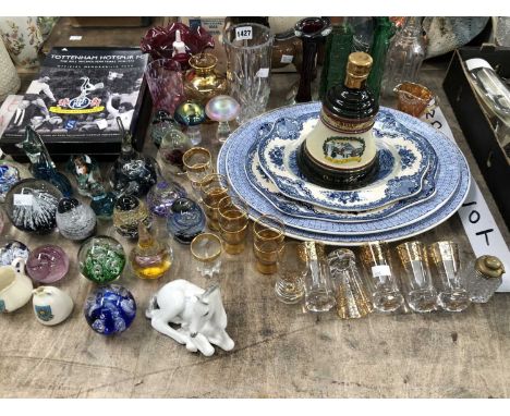 Glass paperweights, drinking glass, platters, Tottenham FC memorabilia, a Christmas 1990 Bells bottle of whiskey, etc.