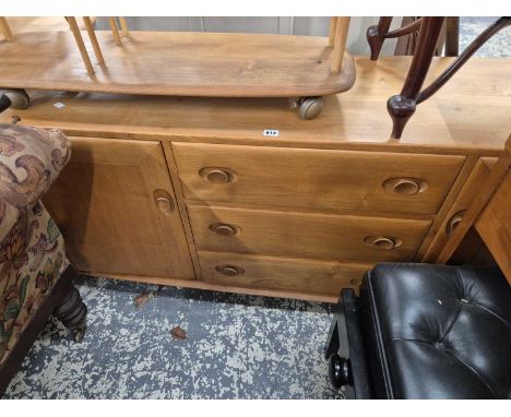 An Ercol pale elm sideboard. H 69 W 156 D 46cms