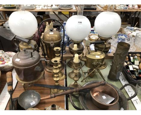 Three oil lamps, brass and copper kettles, brass candlesticks, a copper ladle, sauce pan, etc