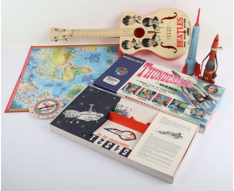 A Selcol Beatles New Sound Guitar, 1960s, plastic guitar with strings and pegs and images of the Fab Four, John, Ringo, Paul 