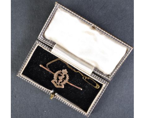 A WWII Second World War R.A.M.C Royal Army Medical Corps 9kt gold sweetheart brooch. The brooch depicting the regimental insi