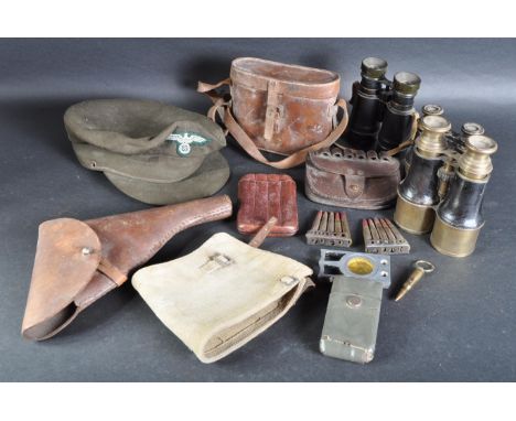 A collection of assorted WWI First World War and WWII Second World War military items to include; replica German Third Reich 