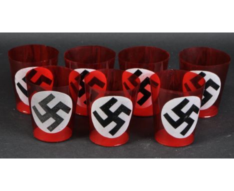 A collection of x7 WWII Second World War Third Reich Nazi German funeral candle cups. Red celluloid with a cardboard bottom a