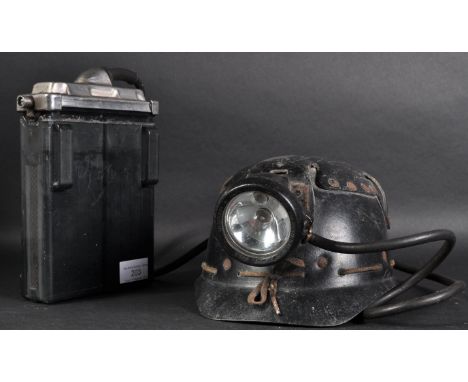 A vintage 1950s British coal miners helmet, headlamp and battery pack. The battery pack being an Oldham &amp; Son of Manchest