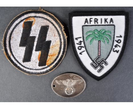 A collection of assorted WWII Second World War Third Reich Nazi German replica items comprising; Afrika Korps patch, SS Sport