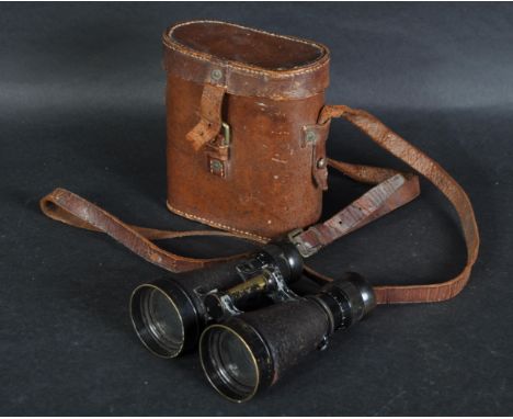 A pair of WWI First World War British Army field binoculars. The binoculars clad in embossed leather with British Military in