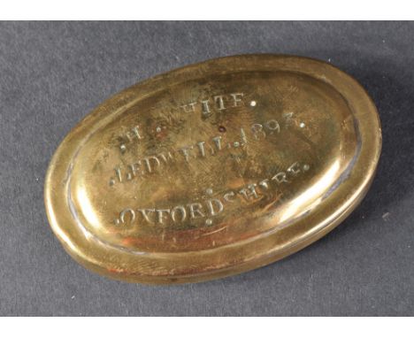 A 19th Century small brass tobacco or snuff box. Punched to the top H. White, Ledwell 1893 Oxfordshire.
The oval hinged box m