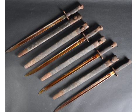 Four original WWI First World War era 1907 pattern Lee Enfield sword bayonets. The bayonets having a hooked steel pommels wit