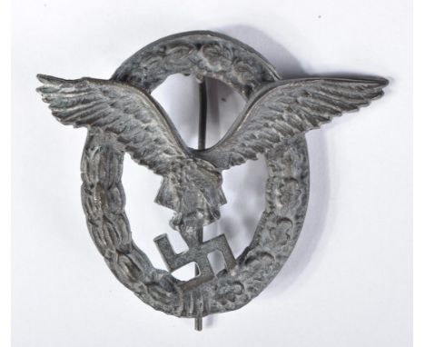 A WWII Second World War Third Reich Nazi German Luftwaffe pilots badge. Central swopping eagle clutching a Swastika motif, su