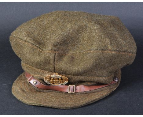 A WWI First World War British Army ( Essex Regiment ) peaked dress service cap. The khaki peaked cap with front cap badge dep
