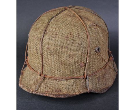 A WWI First World War Imperial German Army M16 steel combat stahlhelm helmet. A camo examples with hessian and wire covering 