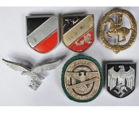A collection of assorted WWII Second World War Third Reich Nazi German medals and badges to include; SA Horse Specialist badg