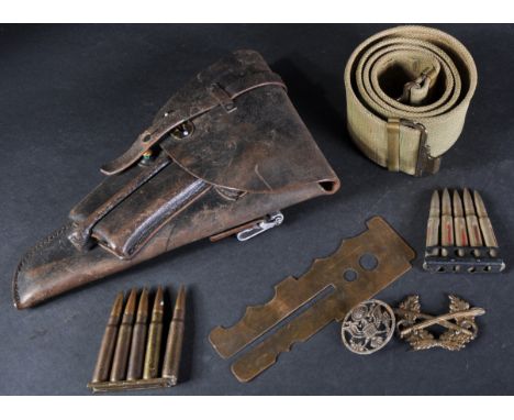 Militaria; a early to mid 20th Century leather pistol gun holster, with compartments for magazines and gun cleaning accessori