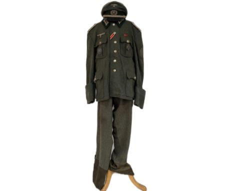 An original WWII Second World War Third Reich Nazi German Officers full dress uniform with peaked cap and medals. The uniform