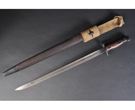 An original WWI First World War era 1907 pattern Lee Enfield sword bayonet. The bayonet having a hooked steel pommel with wor