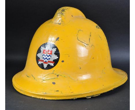 A vintage Cromwell made London Fire Brigade Fire Fighters helmet. Yellow fiberglass construction with front London Fire Briga