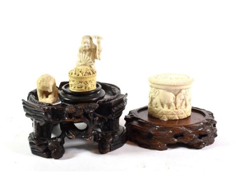 A 19th century Canton carved ivory box containing mother-of-pearl gaming counters; a Japanese Meiji period bear form netsuke;