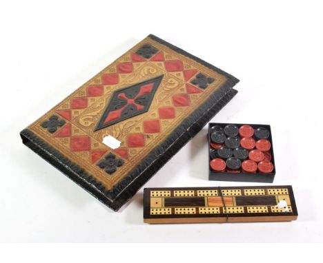 Third Reich book-form backgammon board, the counters with swastika emblem; and a cribbage board