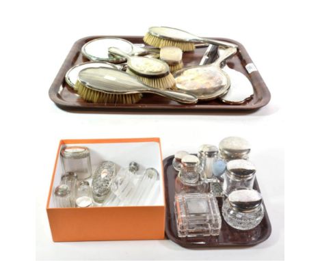 A quantity of silver-mounted dressing-table jars and other dressing table items, including: three differing hair-brushes, two