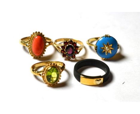 A seed pearl and blue enamel ring, stamped '15CT', finger size L; a 9 carat gold garnet cluster ring, finger size L; a 9 cara