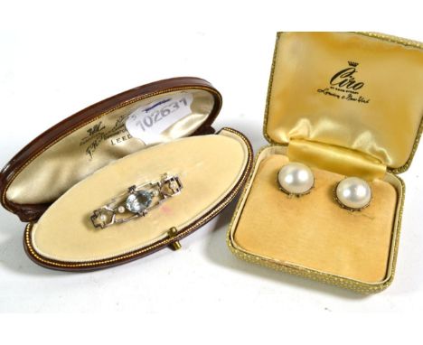 An aquamarine and seed pearl brooch, length 4cm, cased by F R Turner &amp; Son; and a pair of pearl type earrings in white be