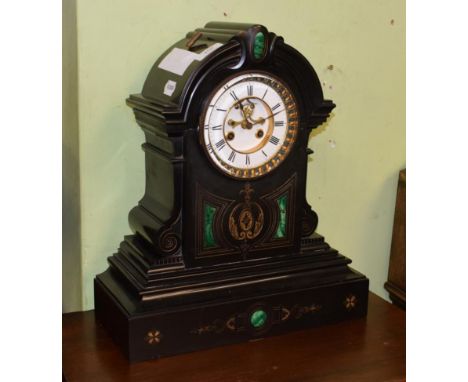 A Victorian black slate and malachite set striking mantel clock, enamel dial with recessed centre with visible Brocot escapem