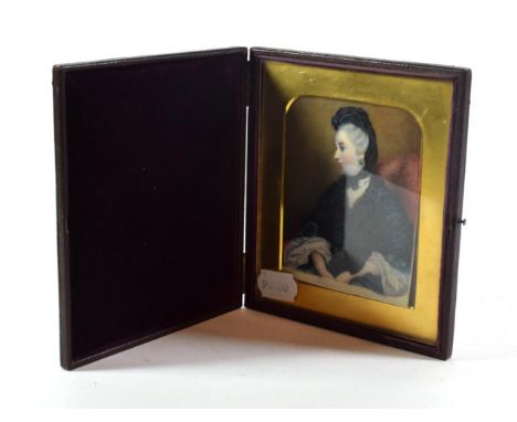 Victorian school: a miniature portrait of a lady, half length seated, wearing a black scarf and dark green dress, on ivory, 1