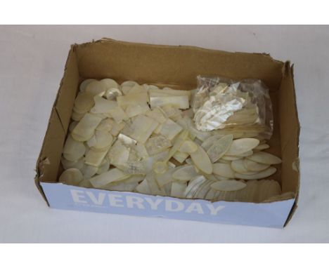 Large collection of Mother of Pearl gaming counters in various styles to include Fish, most with carved decoration