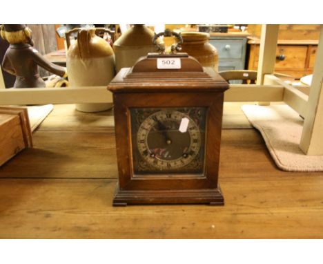Garrards Wooden cased Bracket style Mantle Clock with ornate Silvered Metallic dial and Brass carry handle, comes with Key &a