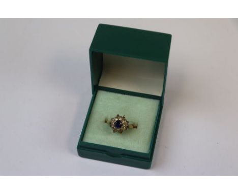 Boxed ladies Hallmarked 9ct Gold dress ring with central Sapphire blue stone