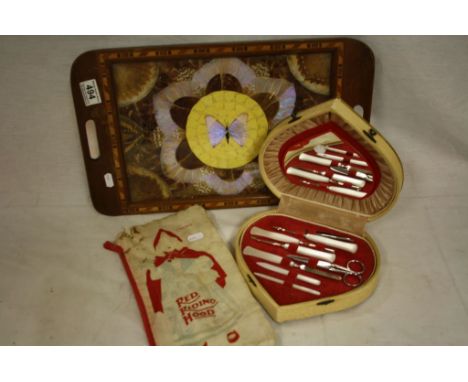Hardwood Serving Tray inset with a pattern of Butterfly Wings, Vintage Cased Manicure Set and a Father Tucks ' Calico ' Serie