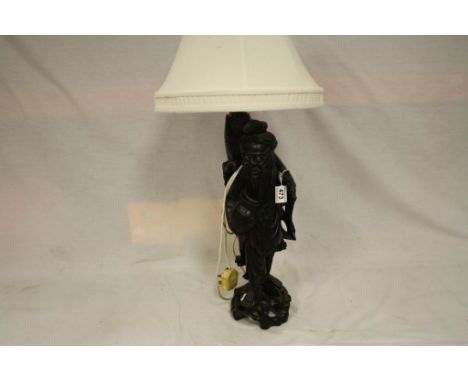 Large carved oriental Wooden lamp in the form of a Fisherman with large Fish to back, stands approx 48cm excluding the fittin