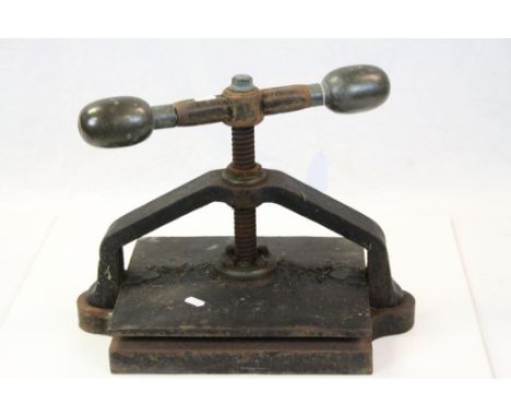 Vintage painted Cast Iron Paper press with Brass grips to the handle, stands approx 34cm