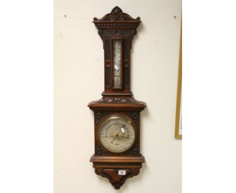 Vintage heavily carved Mahogany wall barometer with Thermometer, marked to the Silvered dial "A Hawes London" and approx 100c