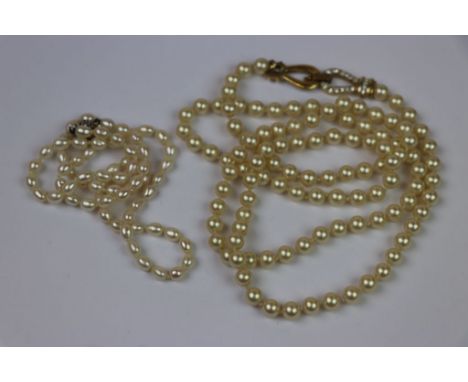 Natural Pearl necklace with Silver catch and a Simulated pearl example