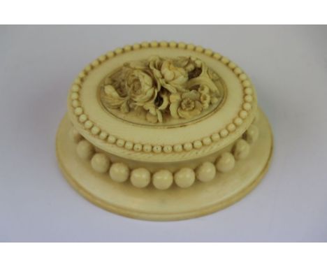 Ornately carved 19th Century Ivory ring or trinket Box, with Ball decorastion and Floral display to lid, measures approx 8.5 