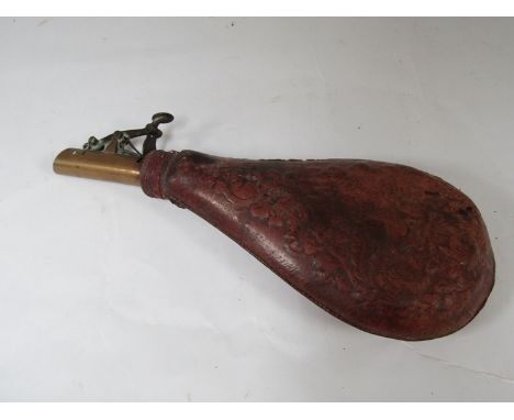 A leather embossed powder flask