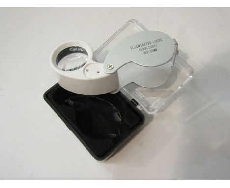 A cased 40x jeweller's loupe with LED light   