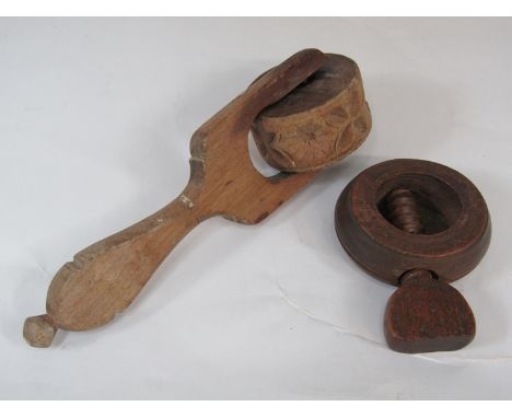 An 18th Century nutcracker and a Victorian butter marker (2)