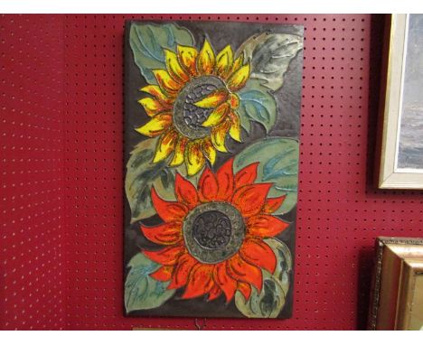 A West German studio pottery style plaque with sunflower detail, 58.5cm x 34.5cm